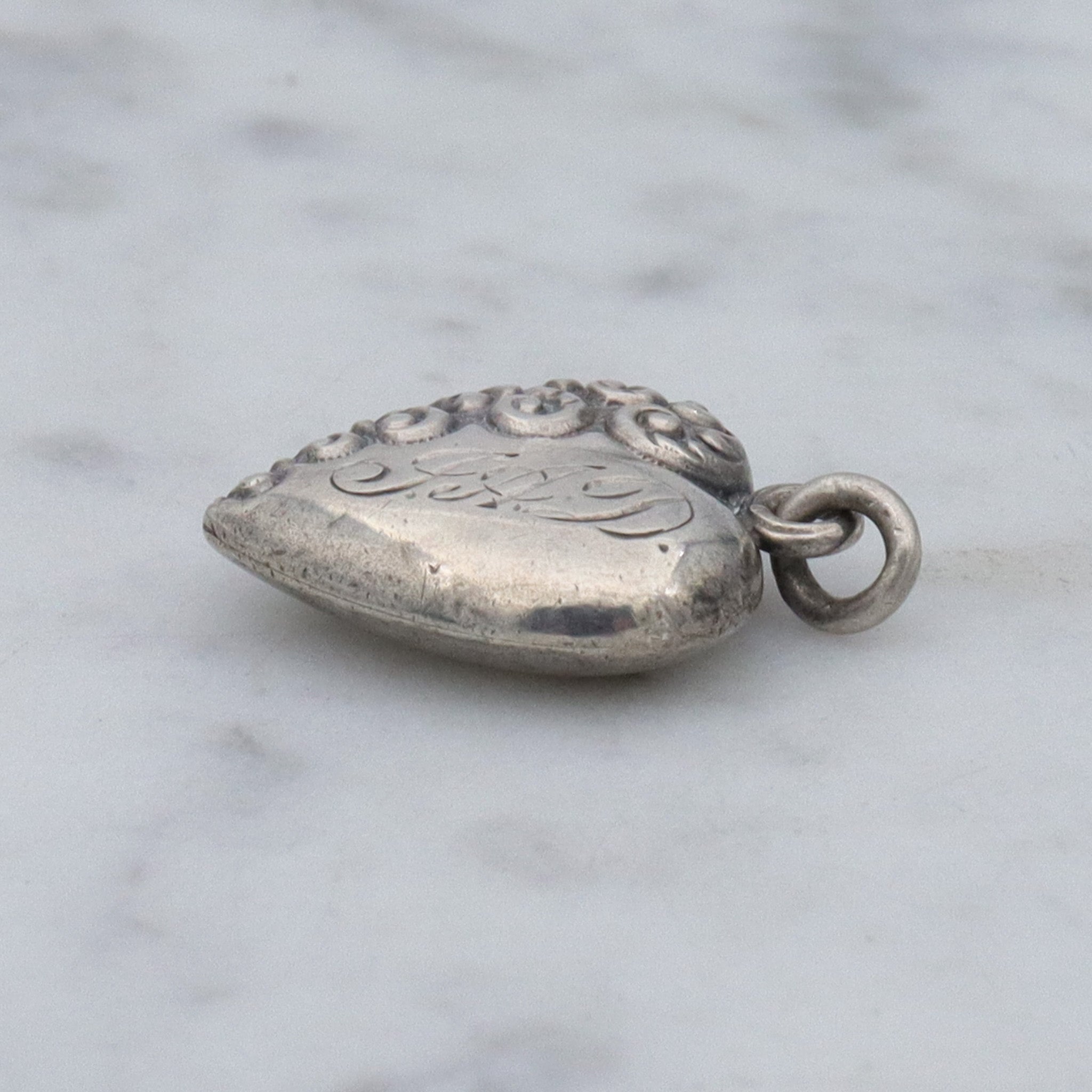 Antique Victorian repousse puffy heart charm pendant with monogram “J.A.D”